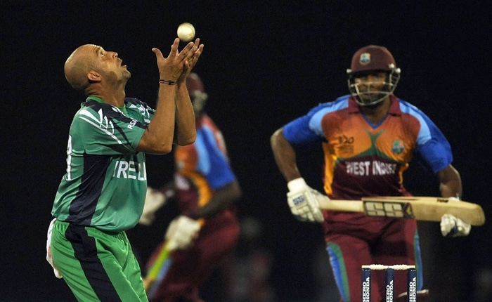 Andre Botha (L) of Ireland takes a return catch of his own bowling to take the wicket of Kieron Pollard of West Indies during their ICC World Twenty20 2010 match at the Providence Stadium in Guyana. (AFP Photo) T20 WC: WI vs IRE