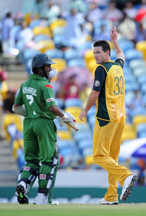 Shaun Tait celebrates after taking the wicket of Bangladeshi batsman Imrul Kayes (not in picture) as Mohammad Ashraful looks on during the ICC World Twenty20 Group A match between Bangladesh and Australia at the Kensington Oval. (AFP Photo) WT 20: Aus vs Ban