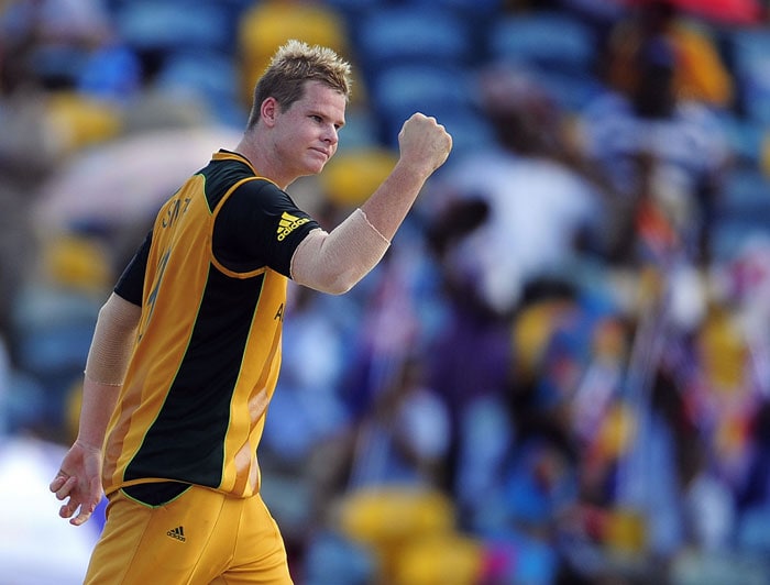 Steven Smith celebrates after Bangladeshi captain Shakib Al Hasan was dismissed during the ICC World Twenty20 Group A match between Bangladesh and Australia at the Kensington Oval. (AFP Photo) WT 20: Aus vs Ban