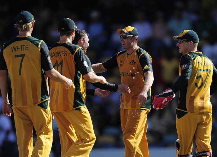 Australian players react after dismissing Bangladeshi batsman Mushfiqur Rahim during the ICC World Twenty20 Group A match between Bangladesh and Australia at the Kensington Oval. (AFP Photo) WT 20: Aus vs Ban