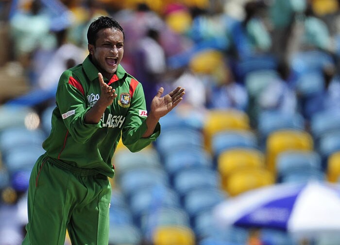 Bangladeshi bowler Shakib Al Hasan celebrates after taking the wicket of Australian batsman Cameron White during the ICC World Twenty20 Group A match between Bangladesh and Australia at the Kensington Oval. (AFP Photo) WT 20: Aus vs Ban