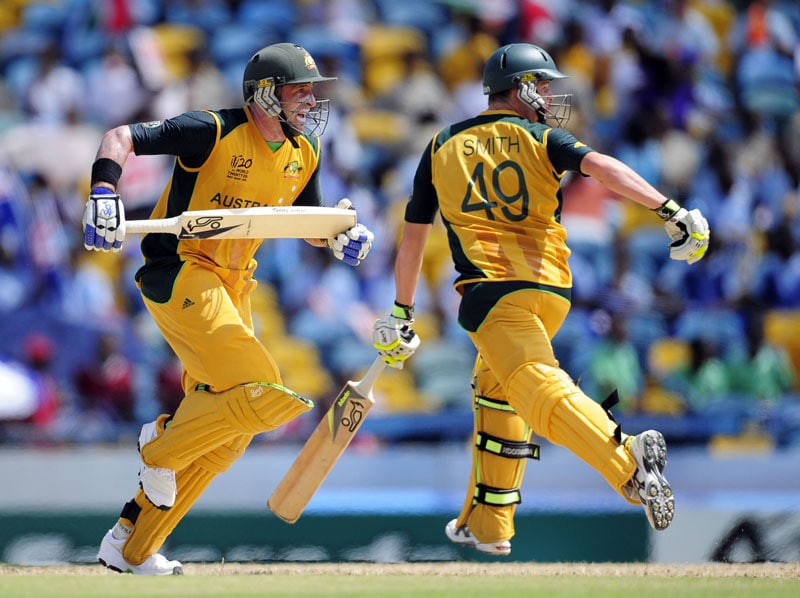 Australian batsmen Michael Hussey (L) and Cameron White score a run during the ICC World Twenty20 Group A match between Bangladesh and Australia at the Kensington Oval. (AFP Photo) WT 20: Aus vs Ban