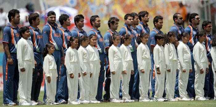 Indian cricketers stand as the national anthems are being played during the ICC World Twenty20 Super Eight match between Sri Lanka and India at the Beausejour Cricket Ground. (AFP Photo) WT20: Ind vs SL