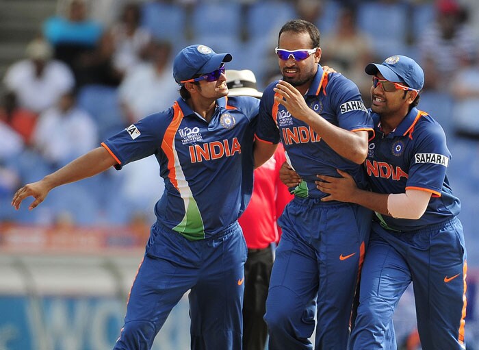 Yusuf Pathan (C) celebrates with teammates Suresh Raina (L) and Rohit Sharma after taking the wicket of Sri Lankan batsman Tillakaratne Dilshan during the ICC World Twenty20 Super Eight match between India and Sri Lanka at the Beausejour Cricket Ground. (AFP Photo) WT20: Ind vs SL