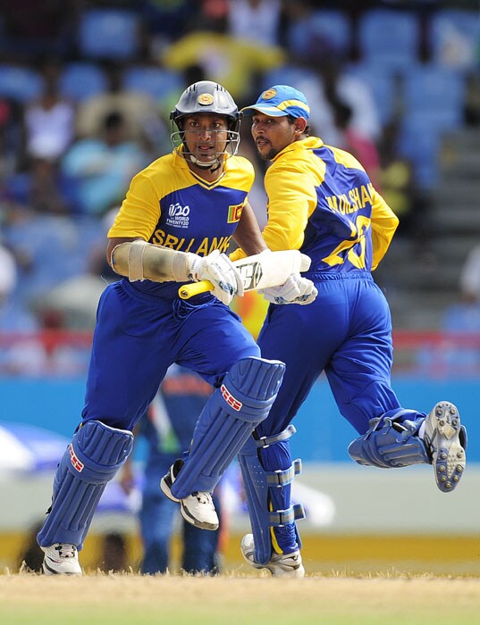 Sri Lankan captain Kumar Sangakkara and batsman Tillakaratne Dilshan score a run during the ICC World Twenty20 Super Eight match between India and Sri Lanka at the Beausejour Cricket Ground. (AFP Photo) WT20: Ind vs SL