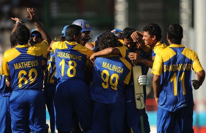 Sri Lankan cricketers celebrate their victory in the ICC World Twenty20 Super Eight match between Sri Lanka and India at the Beausejour Cricket Ground. Sri Lanka won by 5 wickets. (AFP Photo) WT20: Ind vs SL