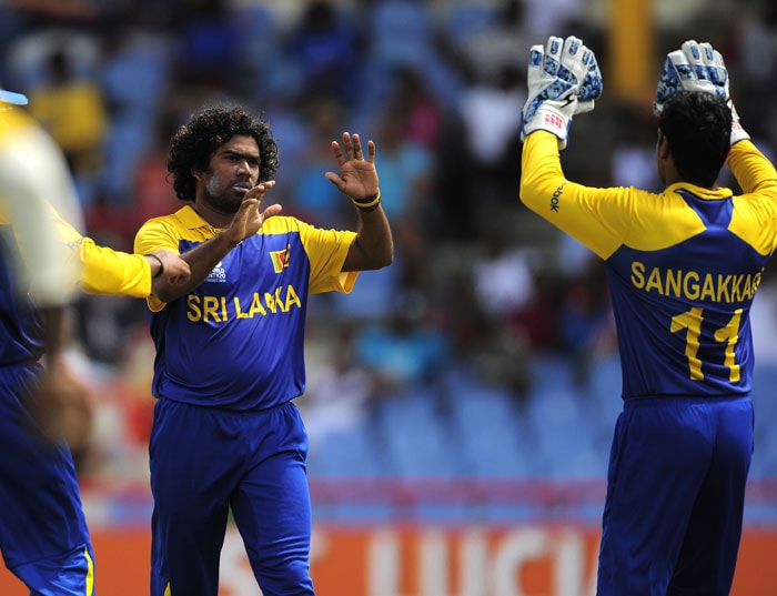 Lasith Malinga (L) celebrates with captain Kumar Sangakkara after taking the wicket of Gautam Gambhir during the ICC World Twenty20 Super Eight match between India and Sri Lanka at the Beausejour Cricket Ground. (AFP Photo) WT20: Ind vs SL