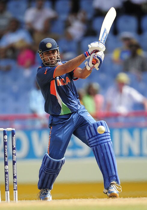 Indian captain MS Dhoni plays a shot during the ICC World Twenty20 Super Eight match between India and Sri Lanka at the Beausejour Cricket Ground. (AFP Photo) WT20: Ind vs SL