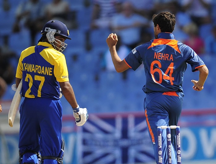 Ashish Nehra celebrates after taking the wicket of Sri Lankan batsman Mahela Jayawardene during the ICC World Twenty20 Super Eight match between India and Sri Lanka at the Beausejour Cricket Ground. (AFP Photo) WT20: Ind vs SL