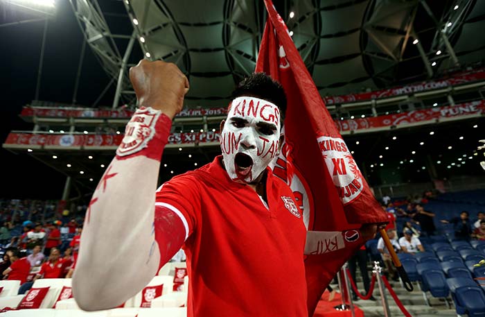 A Kings XI Punjab fan cheers for the George Bailey-led team in Pune during their clash against Rajasthan Royals.