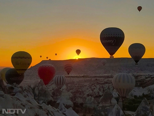 1. Cappadocia, Turkey
Known for its 'Fairy Chimneys', Cappadocia lights up in warm orange tones at dusk. A hot air balloon ride during the golden hour is a once-in-a-lifetime experience.