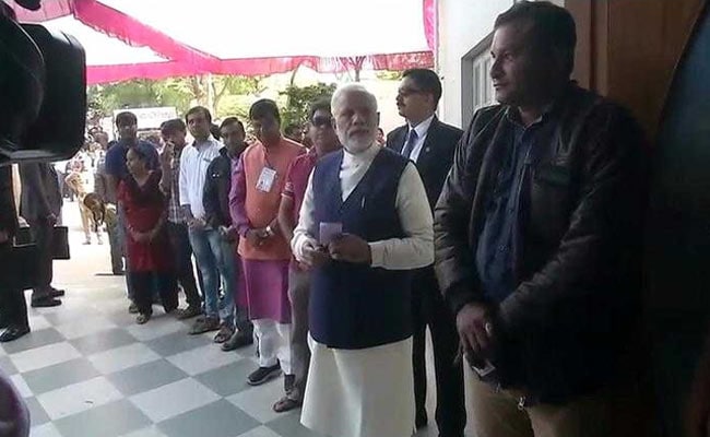 In Gujarat, PM Modi Waits In Voting Queue, Touches Brother's Feet After