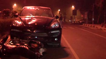 Woman driving Porsche crashes into bike Woman driving Porsche crashes into bike