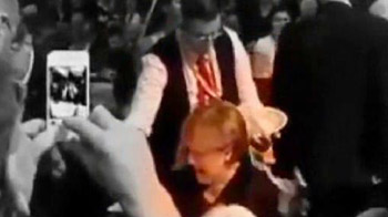 Oops! Beer shower for German Chancellor Angela Merkel