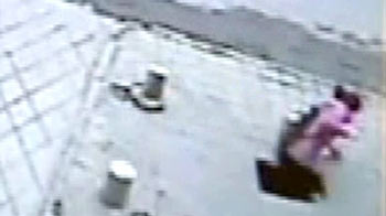 Caught on camera: While talking on cellphone, she fell into huge hole