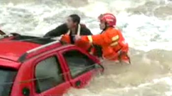 Caught on camera: Man rescued after car fell into river