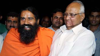 Congress ally Sharad Pawar endorses Baba Ramdev with awkward hug