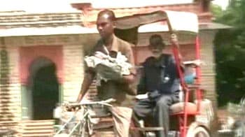 Child strapped to rickshaw puller's chest critical; govt steps in