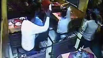 Caught on camera: Men, armed with sticks, vandalise restaurant