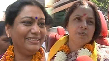 Taking on Narendra Modi are the wives of two controversial men