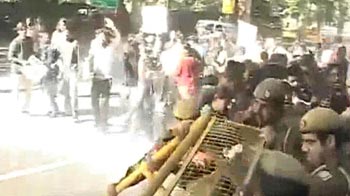 Water cannons used on protesters at chief minister's home