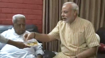 Narendra Modi visits rival Keshubhai Patel, feeds him sweets