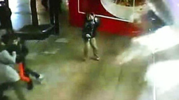 Security cameras capture panic as shark tank explodes Security cameras capture panic as shark tank explodes