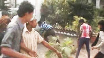 Video : Bengal: Congress minister watches as workers attack District Collector's home