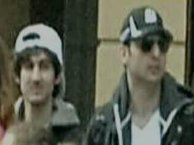 One Boston bombing suspect dead, 2nd at large; area on lockdown