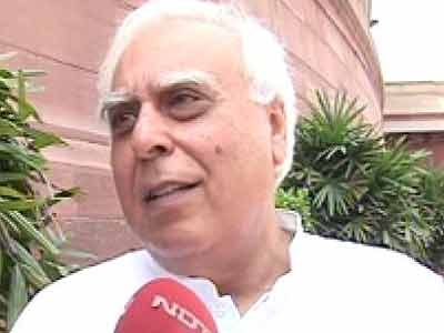 Sibal gets additional charge of Law Ministry, Joshi to handle Railways