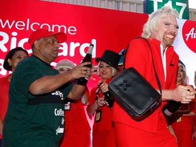 Richard Branson dresses up as air hostess after losing bet Richard Branson dresses up as air hostess after losing bet