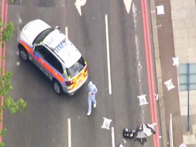 British soldier hacked to death in London street in suspected militant attack British soldier hacked to death in London street in suspected militant attack