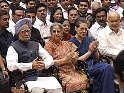 With eye on 2014, new ministers sworn in cabinet