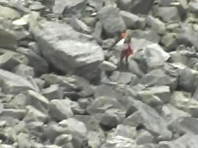 Watch pilgrims try to rush out of the way of boulders