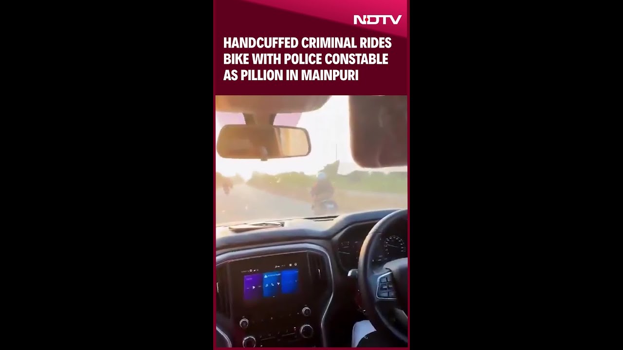 Handcuffed Criminal Rides Bike With Police Constable As Pillion In UP's Mainpuri Handcuffed Criminal Rides Bike With Police Constable As Pillion In UP's Mainpuri