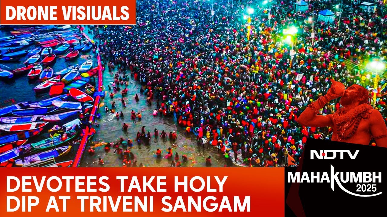Devotees Take Holy Dip At Triveni Sangam For First Amrit Snan Of Maha Kumbh 2025