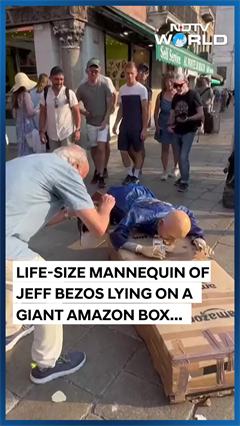 Jeff Bezos Mannequin On A Giant Amazon Box Was Floated Through Venice’s Grand Canal