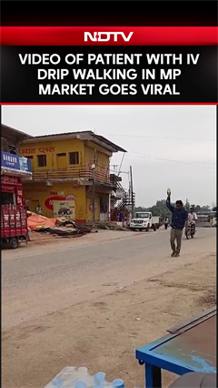Madhya Pradesh News | Video Of Patient With IV Drip Walking In Madhya Pradesh Market Goes Viral