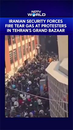 Iranian Security Forces Fire Tear Gas At Protesters in Tehran's Grand Bazaar