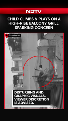 Child Climbs & Plays On A High-Rise Balcony Grill, Sparking Concern