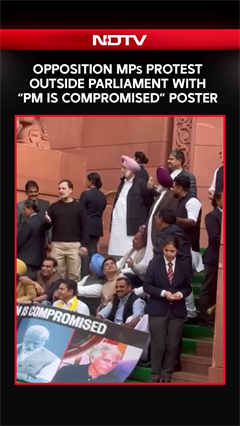 Opposition MPs Protest Outside Parliament With &ldquo;PM Is Compromised&rdquo; Poster
