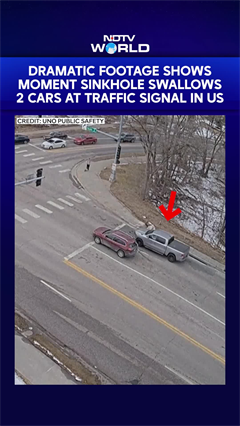 Dramatic Footage Shows Moment Sinkhole Swallows 2 Cars At Traffic Signal In US