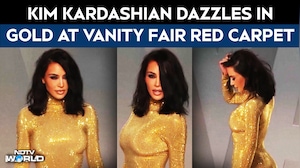 Kim Kardashian Dazzles In Gold At Vanity Fair Red Carpet
