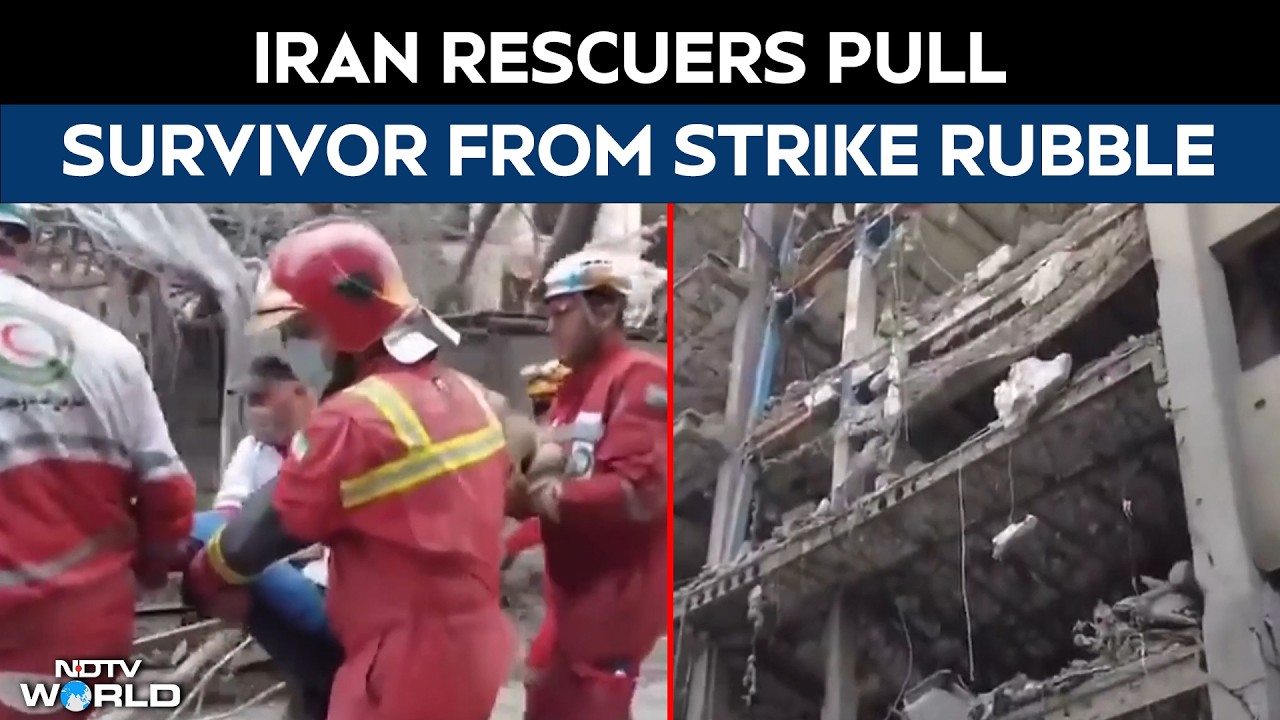 Iranian Rescue Workers Evacuate An Injured Person Alive From The Rubble