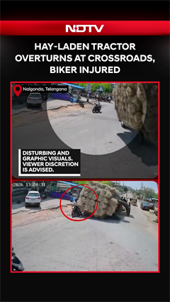 Video: Hay-Laden Tractor Overturns At Crossroads In Telangana, Injures Biker