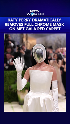 Katy Perry Dramatically Removes Full Chrome Mask To Reveal Her Face On Met Gala Red Carpet