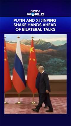 Putin & Xi Jinping Shake Hands Ahead Of Bilateral Talks In Beijing
