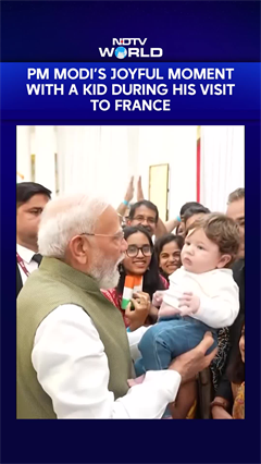 PM Modi's Joyful Moment With A Kid As The Indian Diaspora Welcomes Him In France