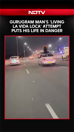 Gurugram Video: Man Sits on Roof of Speeding Cab on NH-48, Sparks Safety Concerns | Viral Video