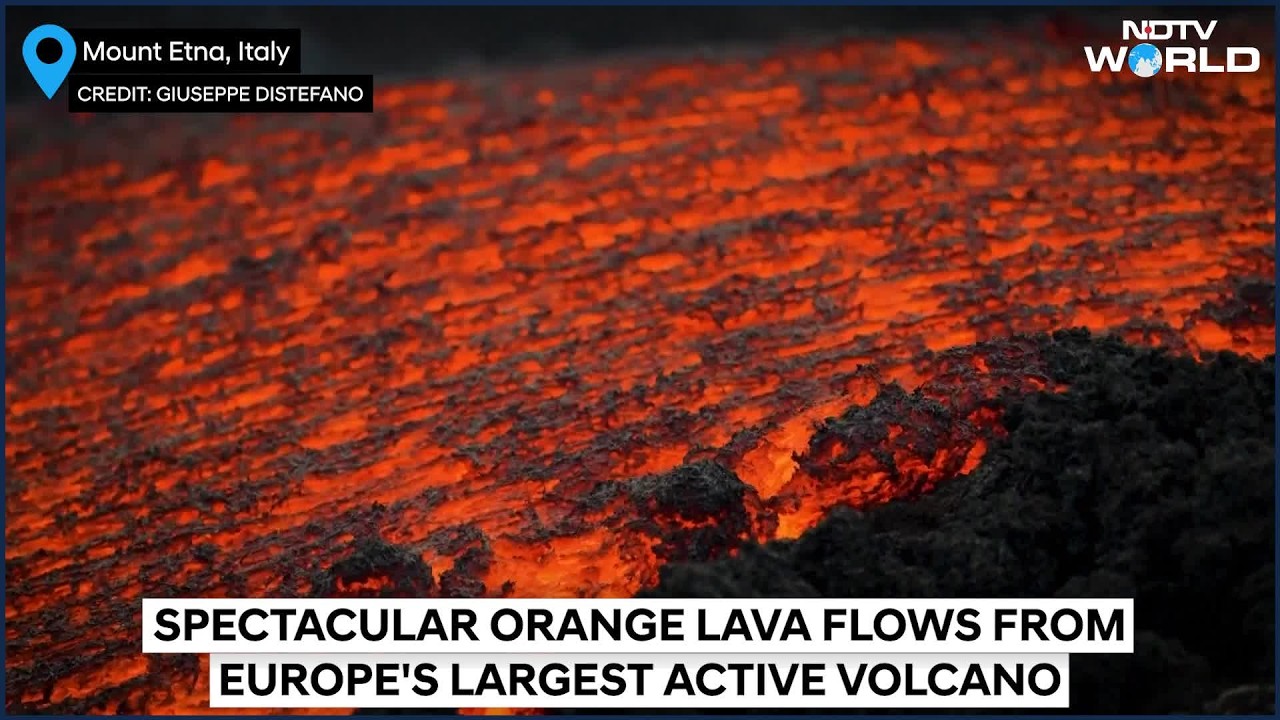 Spectacular Orange Lava Flows Stream From Europe's Largest Active Volcano, Mount Etna